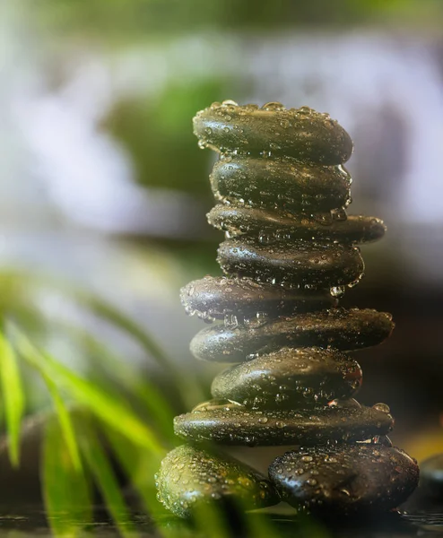 Buddhist meditation concept. Zen stones with water drops stacked on abstract background. Balance between mind, body and soul lead to the acquisition of enlightenment. — Stock Image Buddhist Meditation Concept Zen Stones Water Drops Stacked Abstract Background Royalty Free Stock Images