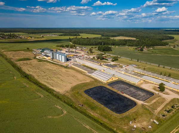 Agricultural , factory aerial view. Green field.