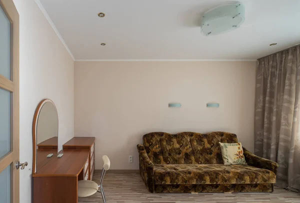 Interior of the flat. Warm tones, wooden floor.