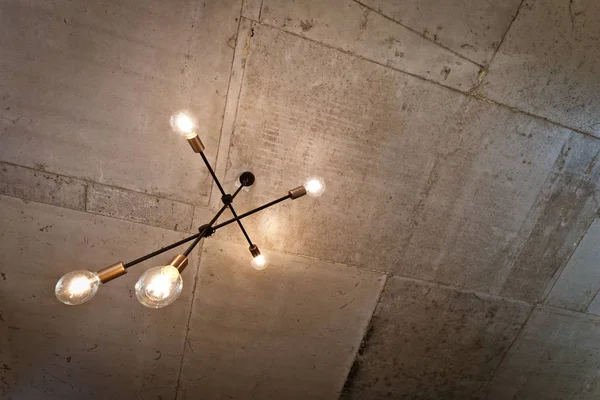 Concrete ceiling and lighting in a modern apartment. Concrete style in the apartment.