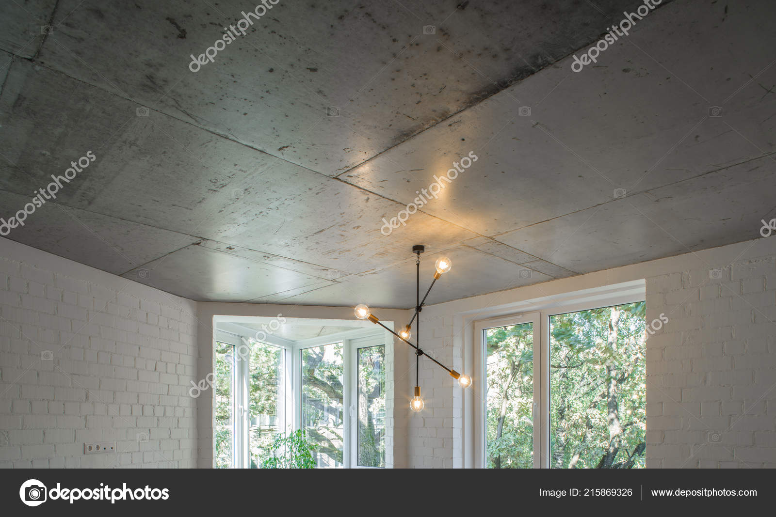 Concrete Ceiling And Lighting In A Modern Apartment Concrete