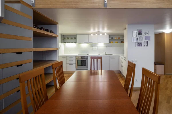 Interior of kitchen. Wooden furniture. White kitchen set.