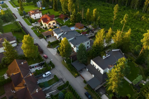 Aerial view of private sector in european city. Luxury exterior. Green trees. Cars and houses.
