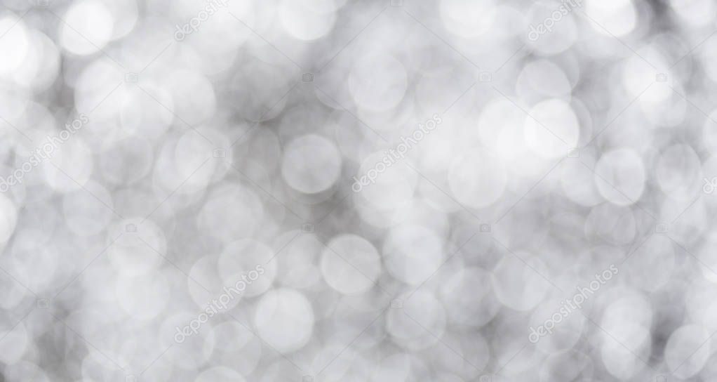 Grey bokeh with white color abstract background can be use as wallpaper