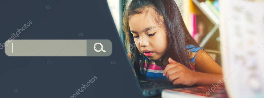 Searching Browsing Internet Data Information Networking and education Concept , asian child using laptop 