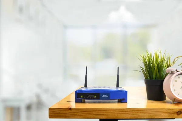 Closeup Wireless Router Man Using Smartphone Living Room Home Ofiice — Stock Photo, Image