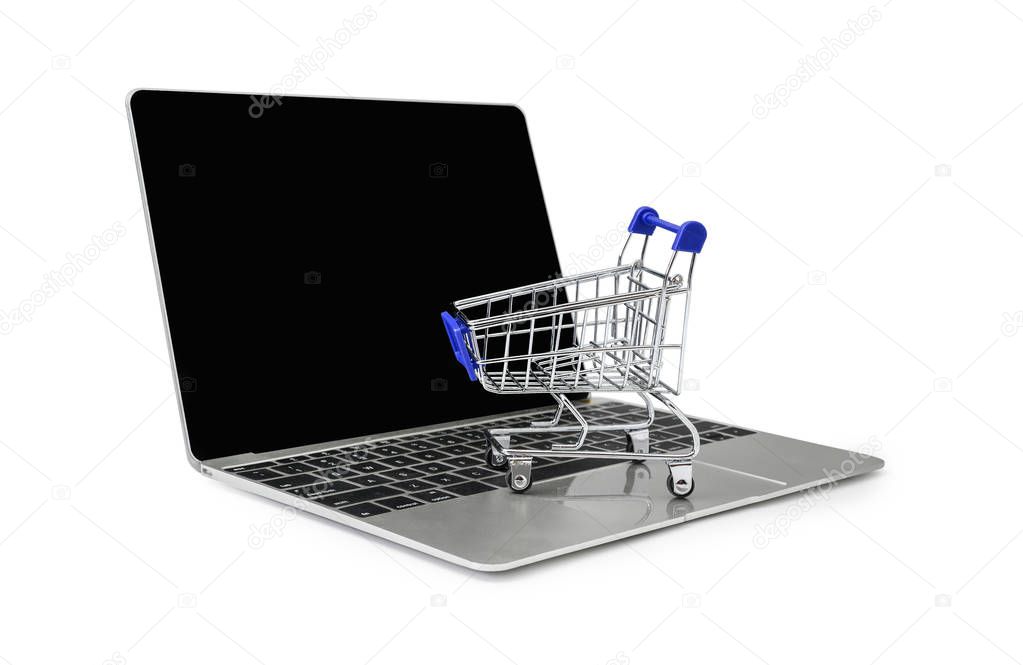 a trolley on a laptop keyboard on white background 