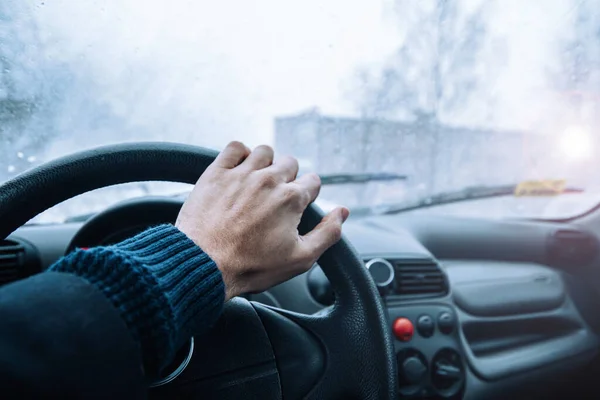 Icy road winter road. Winter conditions on the road. View of the driver.