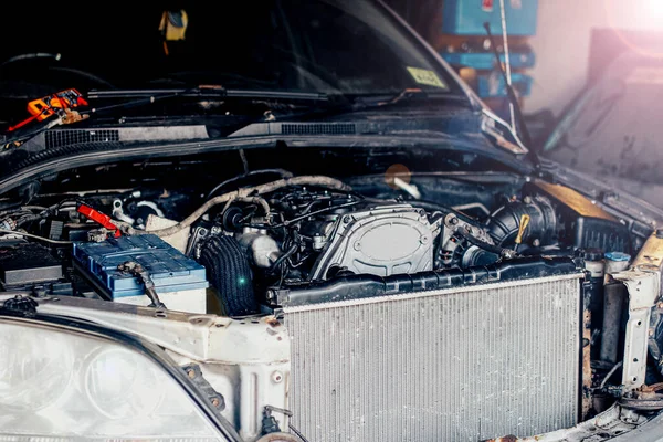 Repair of an internal combustion engine of a car. Details of the motor.