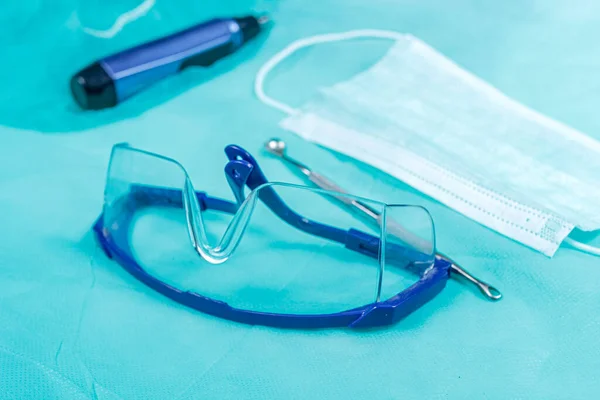 Surgical instruments, glasses and mask