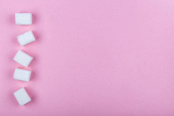 Mockup with sugar on pink paper background. Copy space