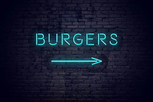 Cihlová zeď s neon šipku a znamení hamburgery — Stock fotografie