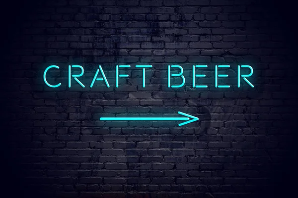 Brick wall with neon arrow and sign craft beer