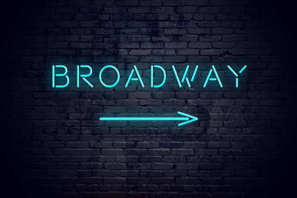 Brick wall with neon arrow and sign broadway — Stock Photo, Image