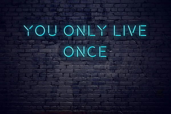 Neon sign with short motivational quote against brick wall — Stock Photo, Image