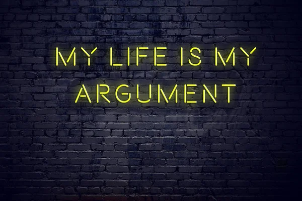 Positive inspiring quote on neon sign against brick wall my life is my argument — Stock Photo, Image