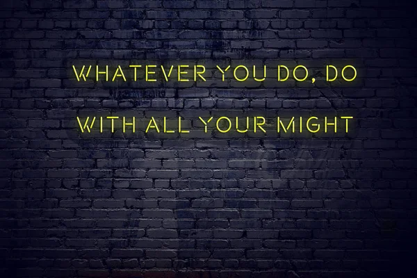 Positive inspiring quote on neon sign against brick wall whatever you do do with all your might — Stock Photo, Image