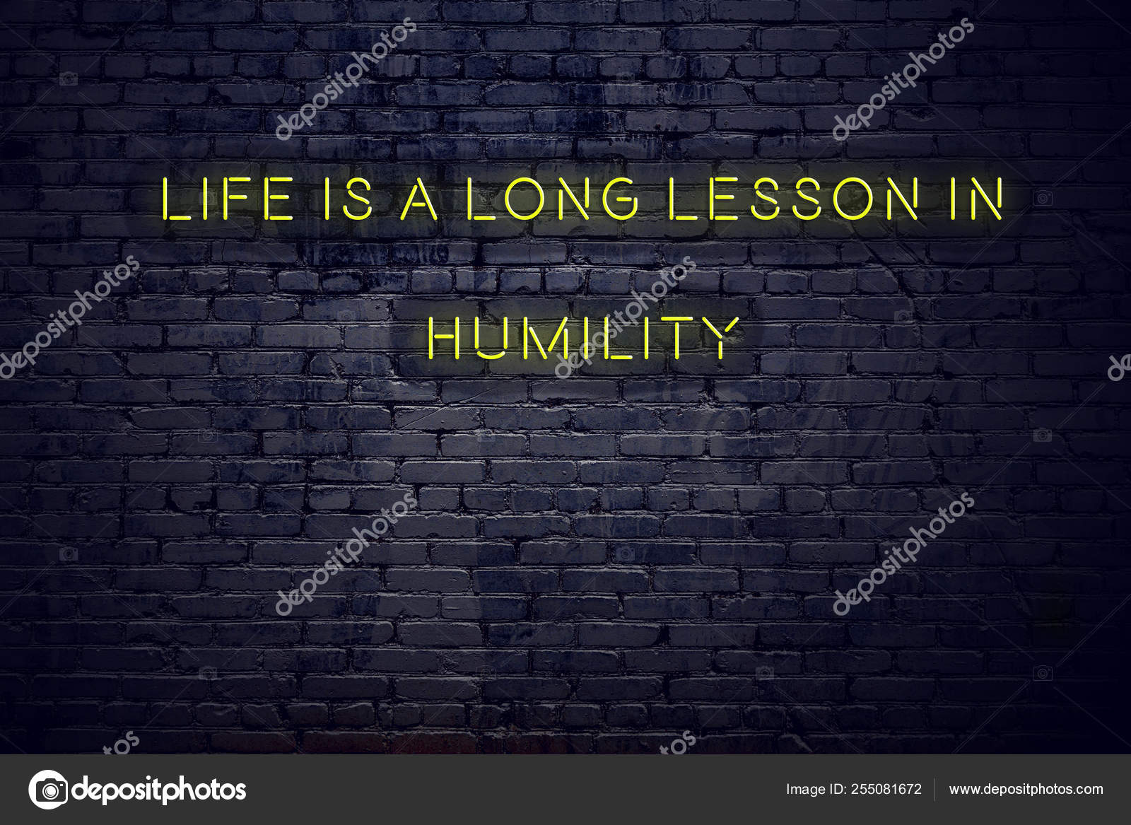 Positive inspiring quote on neon sign against brick wall life is a long ...