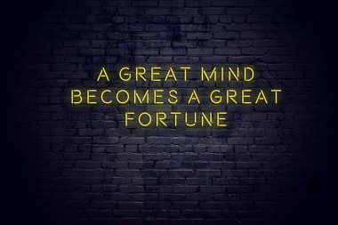 Tuğla duvara karşı olumlu bilge motivasyonel teklif ile Neon işareti 