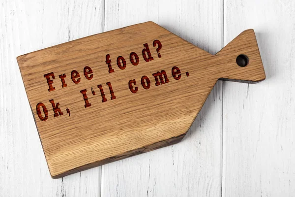 Wooden cutting board with wise inscription about food — Stock Photo, Image