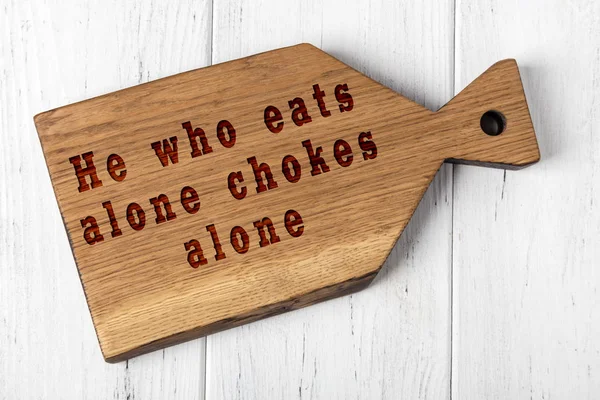 Wooden cutting board with wise inscription about food — Stock Photo, Image