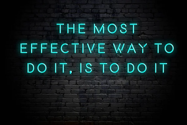 Neon inscription of positive wise motivational quote against brick wall — Stock Photo, Image