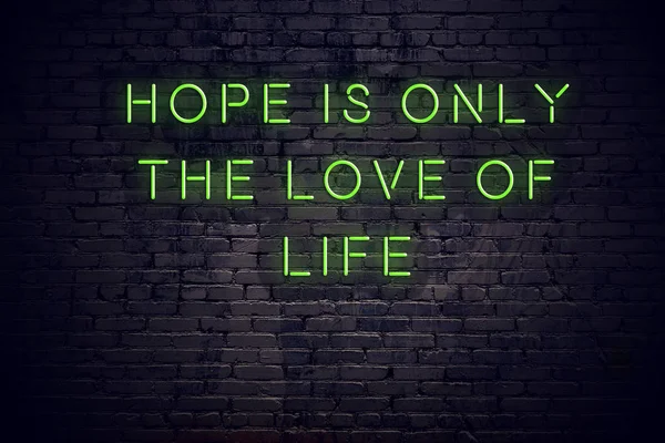 Neon inscription of positive wise quote against brick wall — Stock Photo, Image