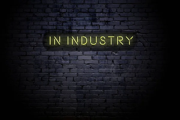 Markerad tegelvägg med neoninskription i industrin — Stockfoto