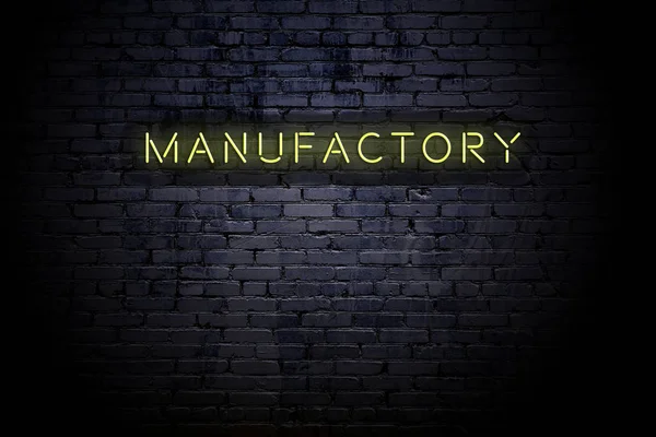 Markerad tegelvägg med neoninskrift Manufactory — Stockfoto
