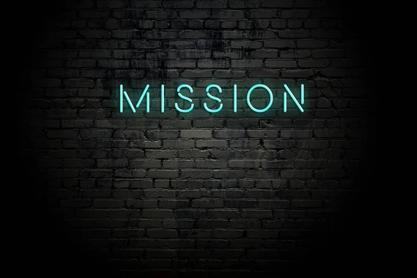 Highlighted brick wall with neon inscription mission — Stock Photo, Image