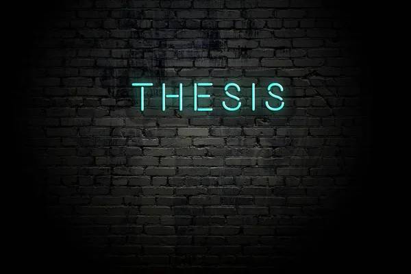 Highlighted brick wall with neon inscription thesis — Stock Photo, Image