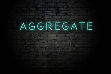 Neon yazıta agrega ile vurgulanmış tuğla duvar