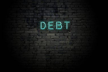 Neon yazıt borç ile vurgulanmış tuğla duvar