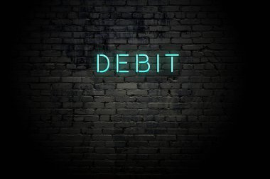 Neon yazıt borç ile vurgulanmış tuğla duvar