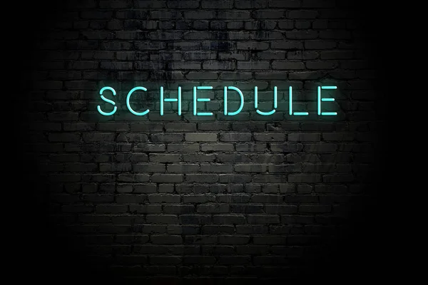 Highlighted brick wall with neon inscription schedule — Stock Photo, Image