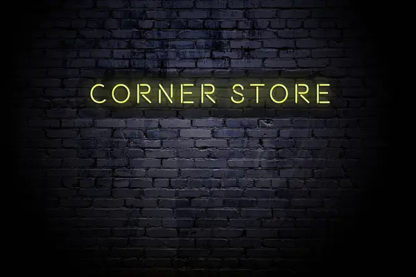 Markerad tegelvägg med Neon inskription Corner Store — Stockfoto