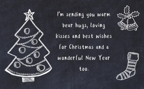 Drawing of christmas tree and handwritten greetings on black chalkboard — Stock Photo, Image