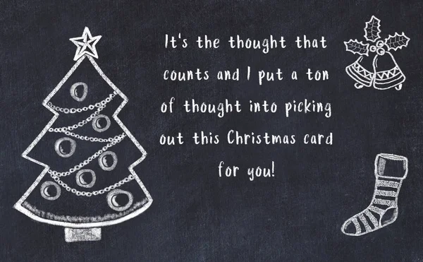 Drawing of christmas tree and handwritten greetings on black chalkboard — Stock Photo, Image