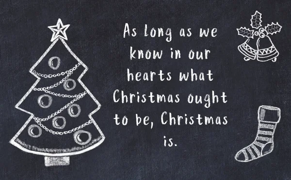 Drawing of christmas tree and handwritten greetings on black chalkboard — Stock Photo, Image