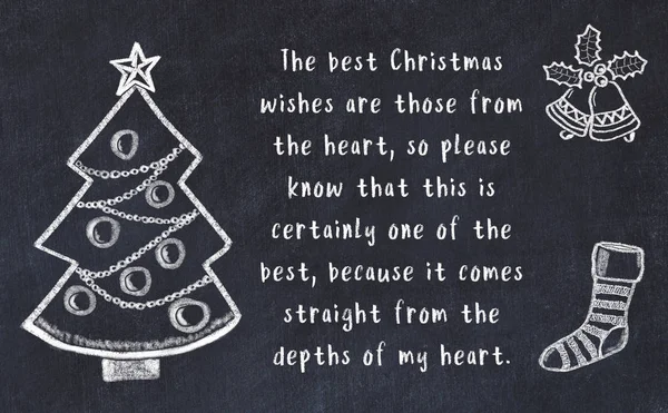 Drawing of christmas tree and handwritten greetings on black chalkboard — Stock Photo, Image