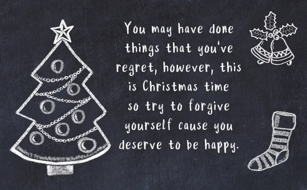 Drawing of christmas tree and handwritten greetings on black chalkboard — Stock Photo, Image