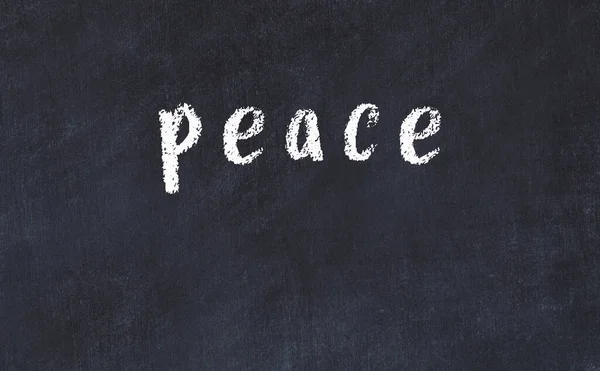 College chalk desk with the word peace written on in — Stock Photo, Image