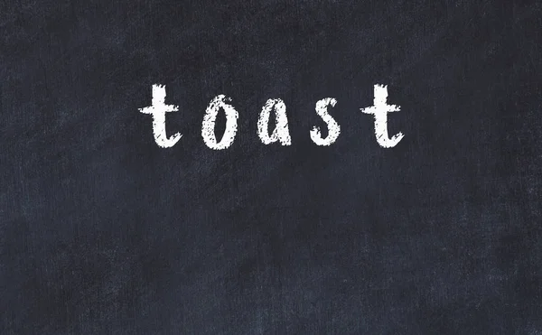 Black chalkboard with inscription toast on in — Stock Photo, Image