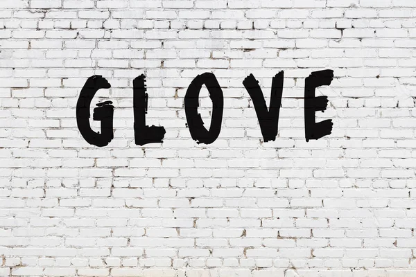 Слово рукавички, намальовані на білій цегляній стіні — стокове фото