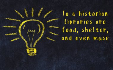 Bir ampulün tebeşir çizimi ve bilgece alıntıların yazımı