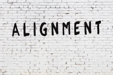 Beyaz tuğla duvara yazı dizimi