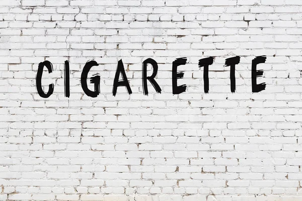 Λευκό τοίχο με μαύρο χρώμα επιγραφή τσιγάρο σε αυτό — Φωτογραφία Αρχείου