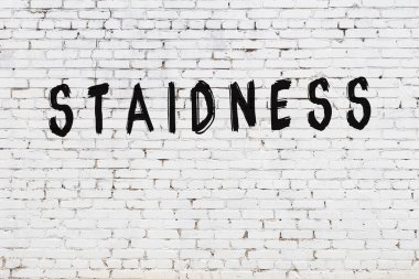 Üzerinde siyah boya izi olan beyaz duvar.