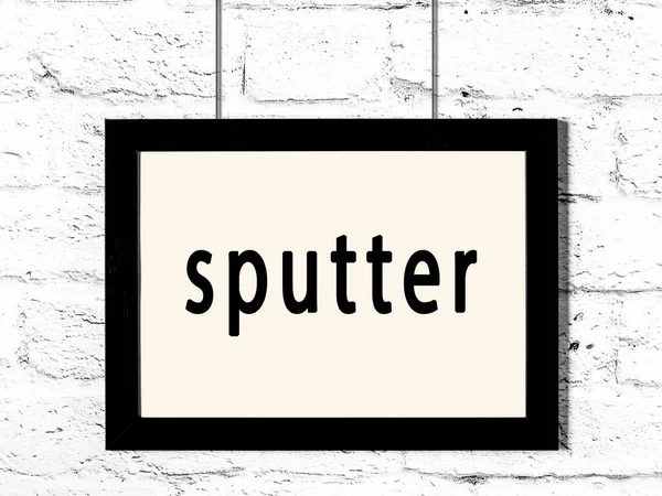 Quadro preto pendurado na parede de tijolo branco com sputter inscrição — Fotografia de Stock