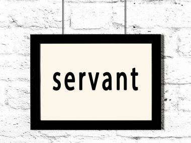 Beyaz tuğla duvarda asılı duran siyah çerçeve.